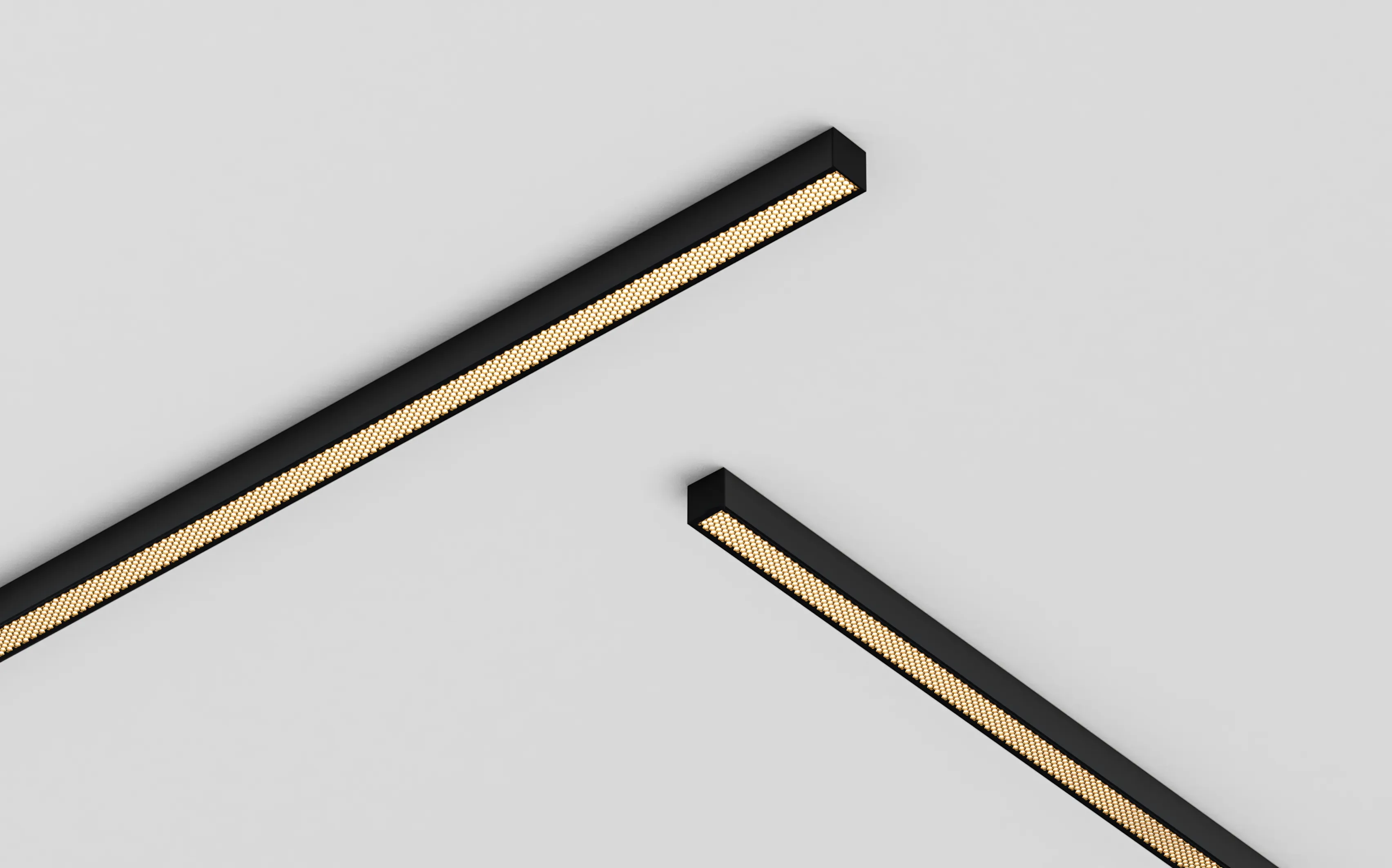 Zwei schwarze GERA Quadra Leuchten mit Abblendraster vor hellem Hintergrund.