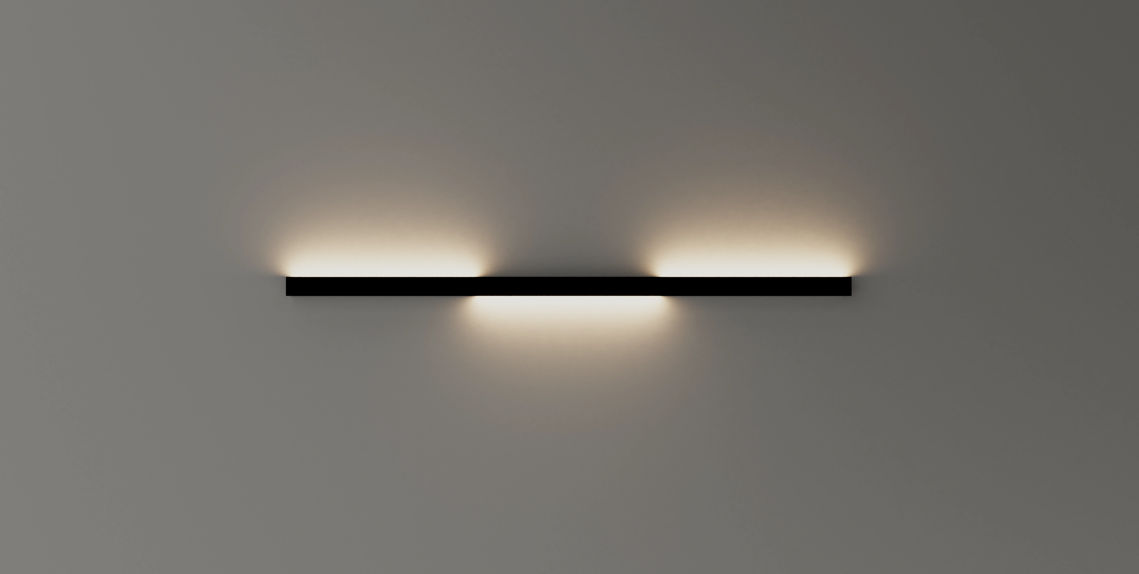 Wandleuchte GERA Quadra Wall in einem minimalistischen abgedunkelten Raum.