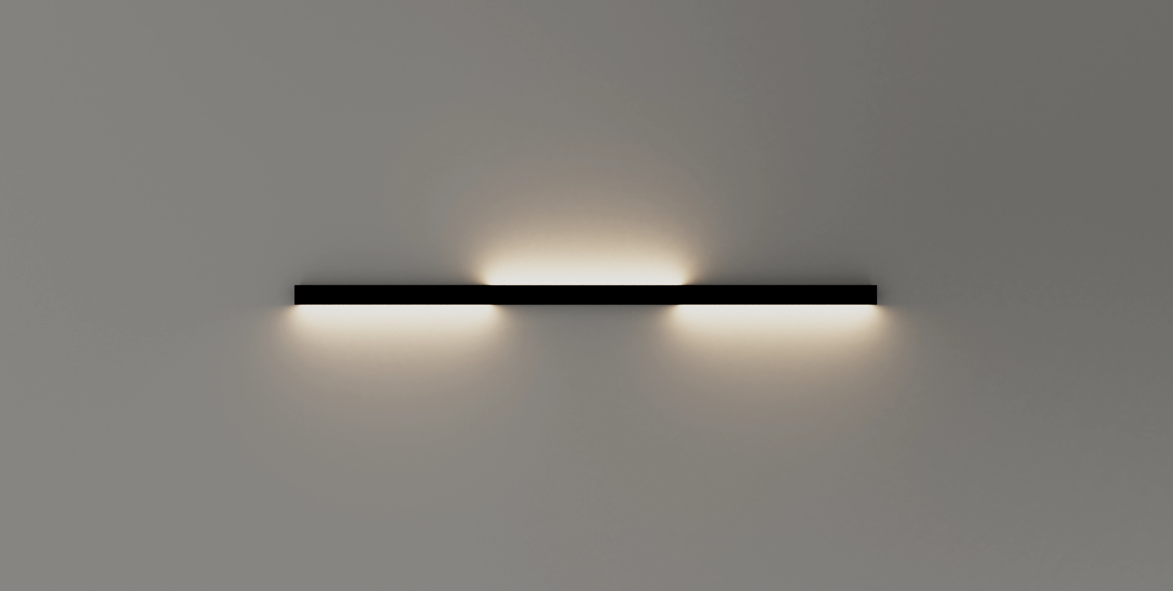 Wandleuchte GERA Quadra Wall in einem minimalistischen abgedunkelten Raum.